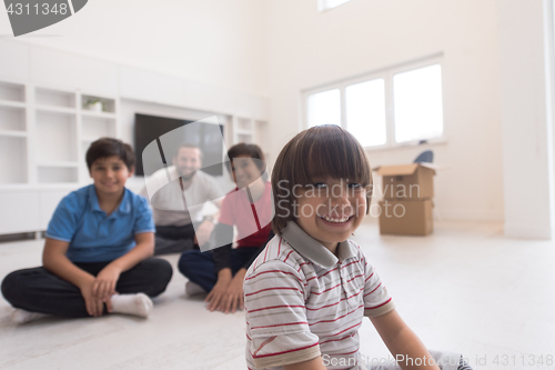 Image of portrait of happy young boys with their dad