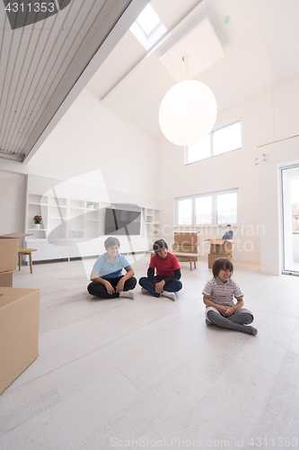 Image of young boys having fun on the floor