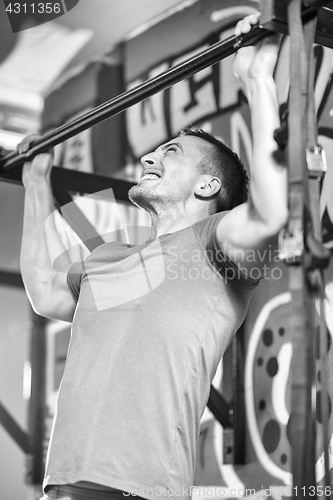 Image of man doing pull ups