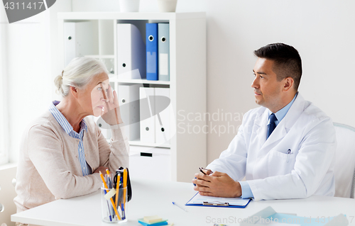 Image of senior woman and doctor meeting at hospital