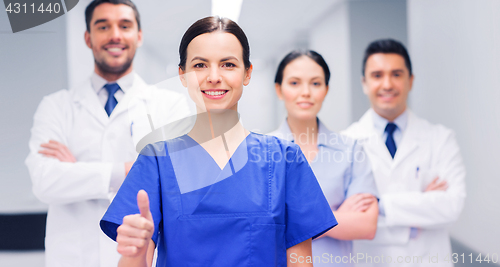 Image of medics or doctors at hospital showing thumbs up