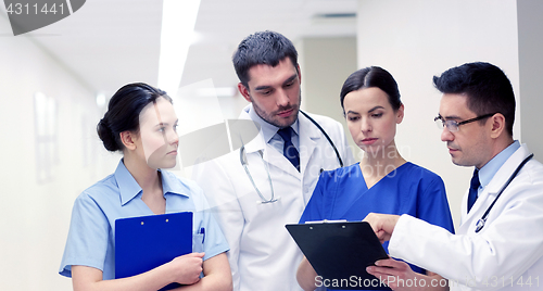 Image of group of medics at hospital with clipboard