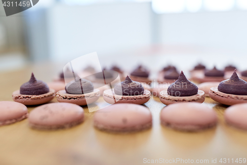 Image of macarons on table at confectionery or bakery