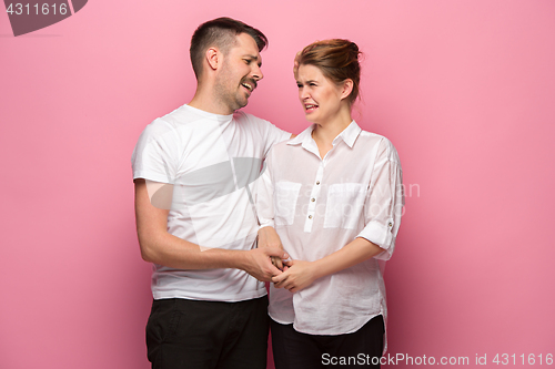 Image of The funny handsome man and his beautiful pregnant wife\'s tummy