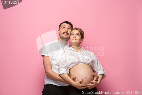 Image of The handsome man and his beautiful pregnant wife\'s tummy