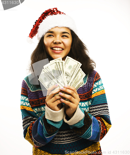 Image of cute young girl in santas red hat with money isolated