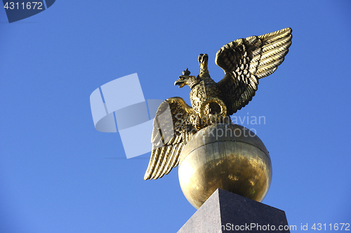 Image of Two headed golden eagle obelisk in the market square in Helsinki