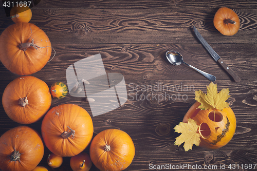 Image of Halloween pumpkin man with knife and fork