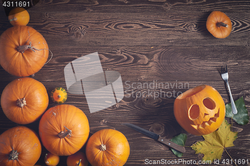 Image of Halloween pumpkin man with knife and fork