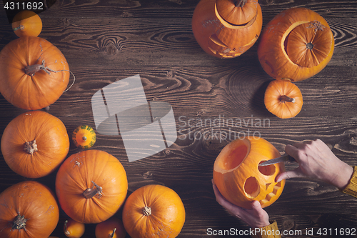 Image of Ripe yellow pumpkins over wooden background
