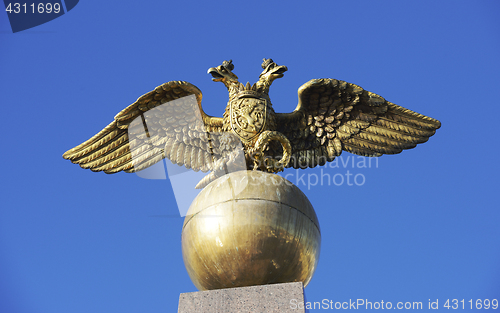 Image of Two headed golden eagle obelisk in the market square in Helsinki