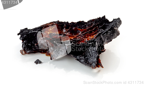 Image of burned croissant on a white background