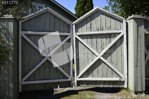 Image of old wooden gate with cracked paint