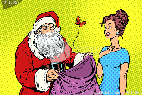 Image of Joyful Santa Claus without gifts and beautiful woman