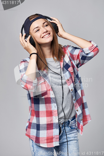 Image of Teen girl listening enjoying music