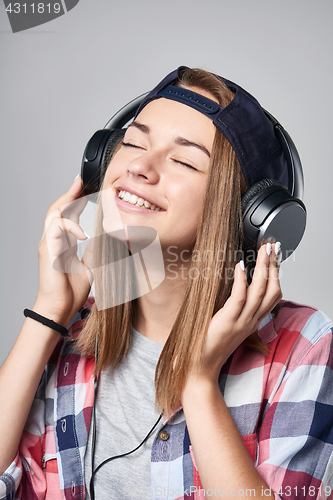 Image of Teen girl listening enjoying music