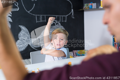 Image of Cute little toddler boy at child therapy session.