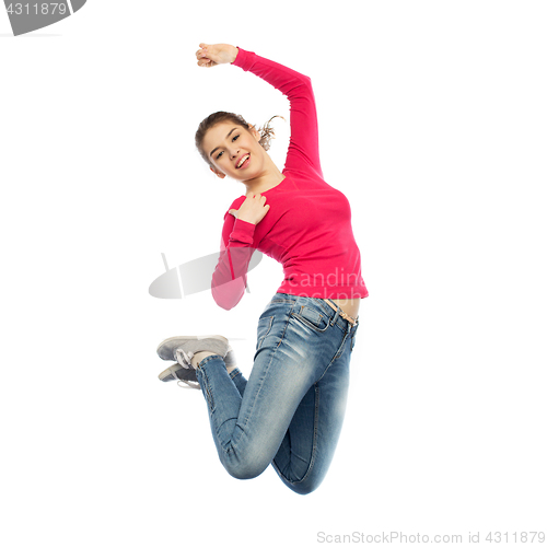 Image of smiling young woman jumping in air