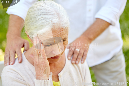 Image of close up of senior woman suffering from headache