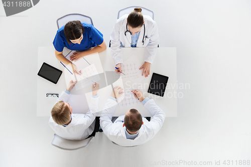 Image of group of doctors with cardiograms at hospital