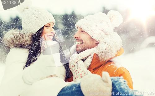 Image of happy couple outdoors in winter