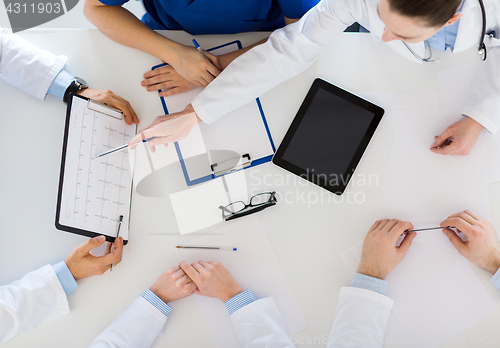 Image of doctors with cardiogram and tablet pc at hospital