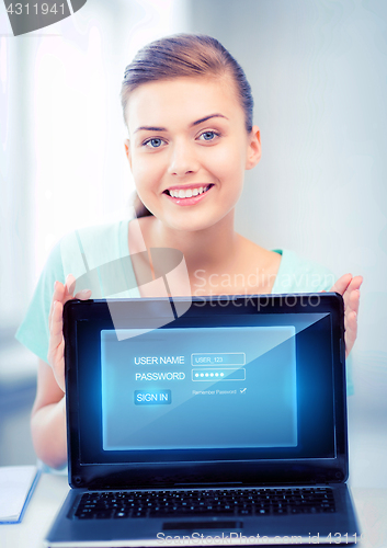 Image of woman with laptop computer and virtual screen