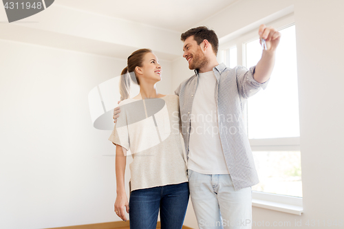 Image of happy couple with keys of new home