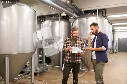 Image of men working at craft brewery or beer plant