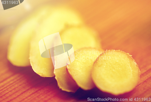 Image of close up of ginger root on wooden table