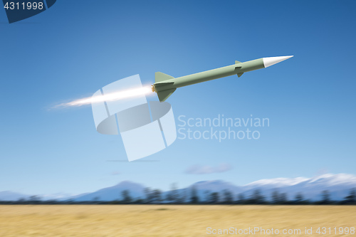 Image of nuclear rocket bomb flying over a landscape field