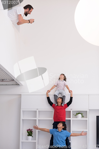 Image of young boys posing line up piggyback