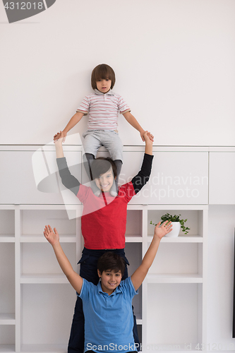 Image of young boys posing line up piggyback