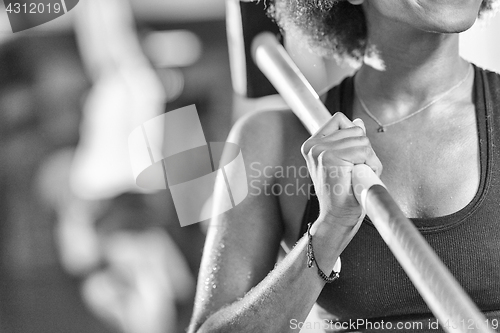 Image of black woman after workout with hammer