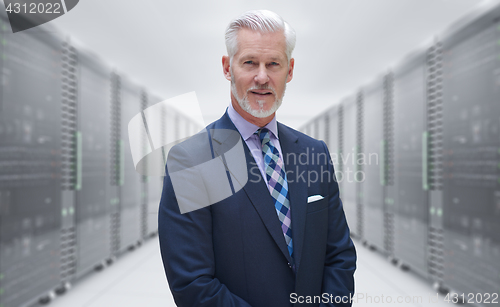 Image of Senior businessman in server room