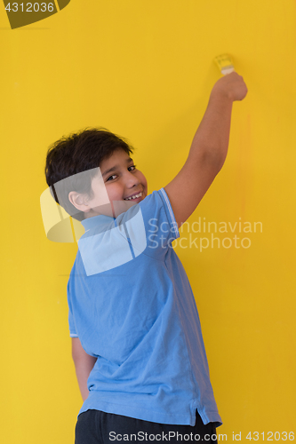 Image of Portrait of a happy young boy painter