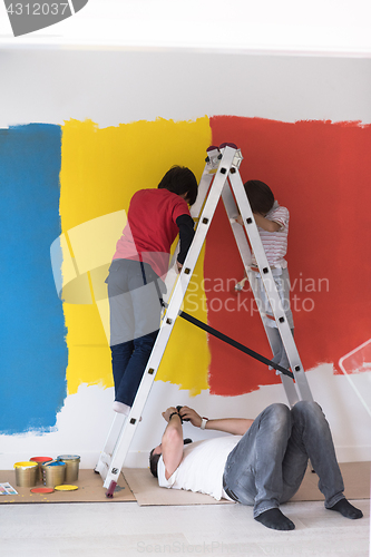 Image of boys painting wall