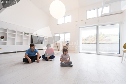 Image of young boys having fun on the floor