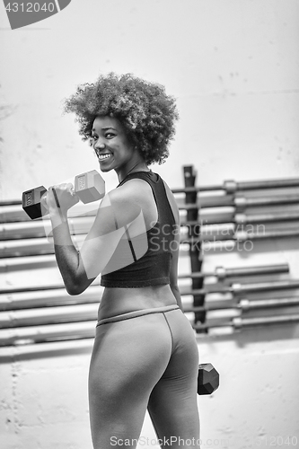 Image of black woman doing bicep curls