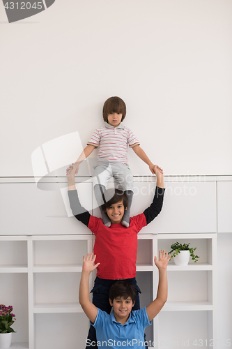 Image of young boys posing line up piggyback