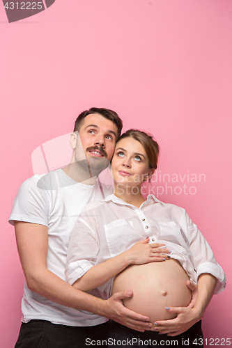 Image of The handsome man and his beautiful pregnant wife\'s tummy