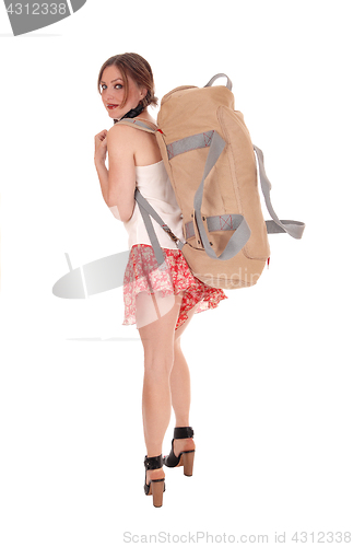 Image of Young woman with big backpack.