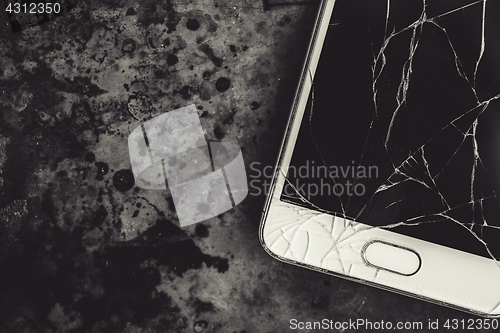 Image of Smartphone with a broken screen.