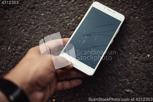 Image of Smartphone with a broken screen.