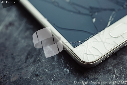 Image of Smartphone with a broken screen.