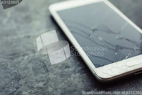 Image of Smartphone with a broken screen.