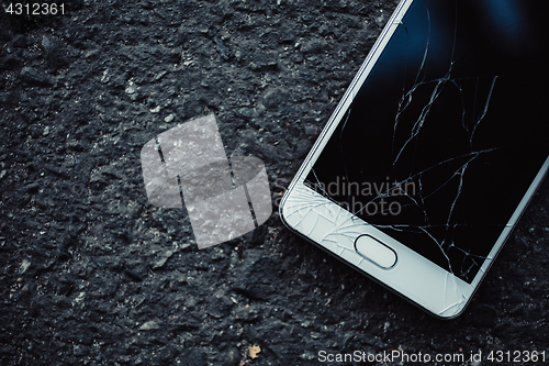 Image of Smartphone with a broken screen.