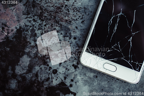 Image of Smartphone with a broken screen.