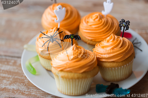 Image of halloween party decorated cupcakes on plate