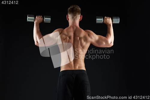 Image of man with dumbbells exercising